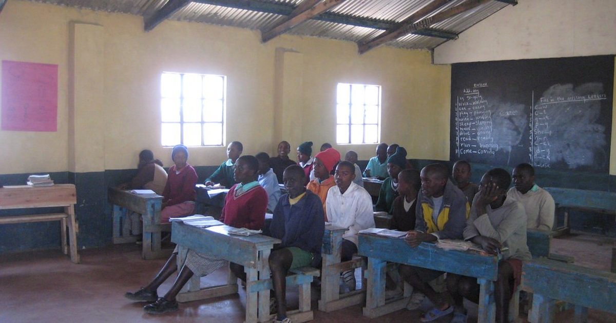 Pupils studying at desks in a Kenyan school classroom