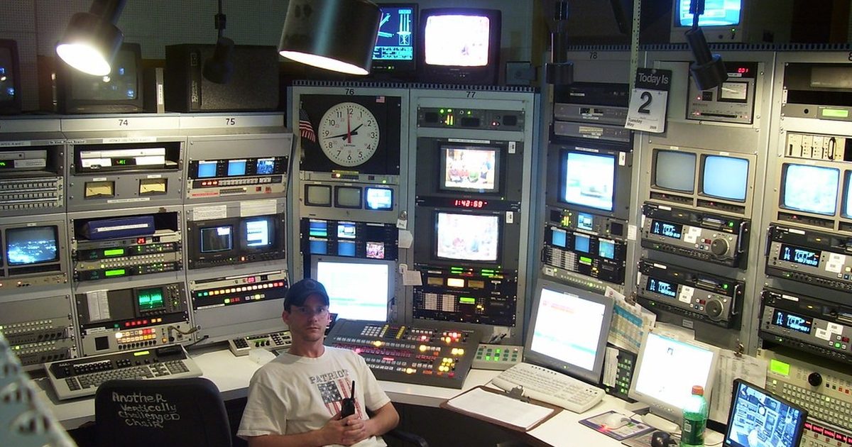 Operator in a control room surrounded by monitors