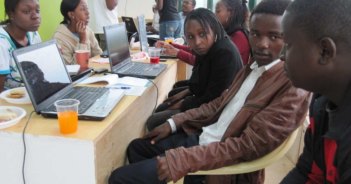 Young developers working on laptops at a tech hub in Nairobi